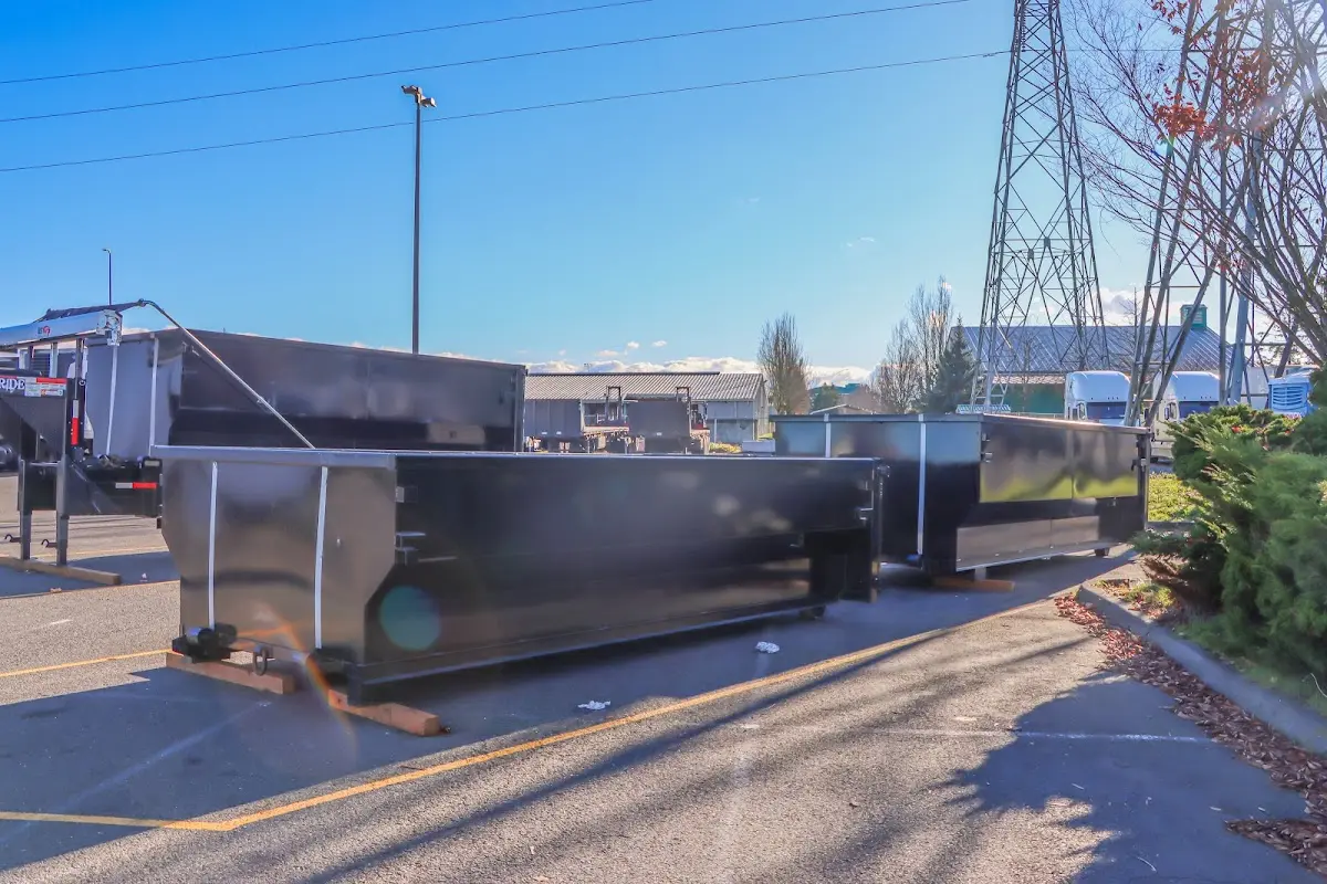 Roll-off dumpster ready for waste disposal at job site for 3 Yard Dumpster Rental in Falmouth